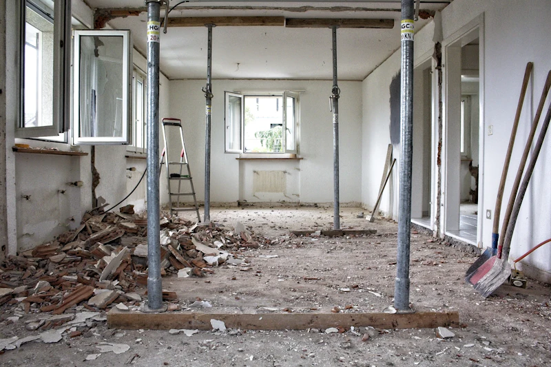 Room under renovation with temporary props and debris